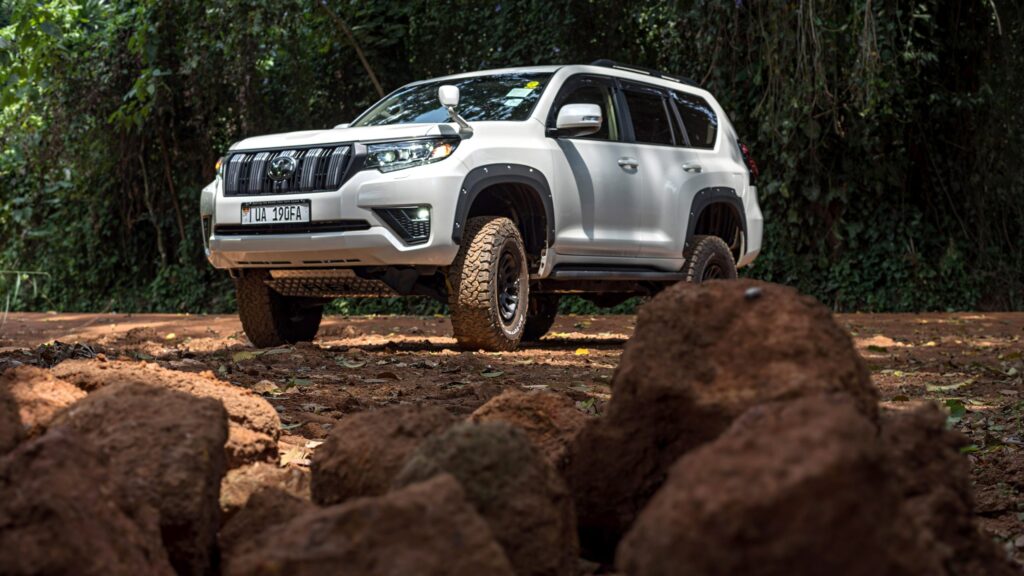 Land Cruiser Prado on a red dirt track